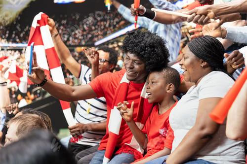 Preview: Family filming video of celebrating together with son during football match