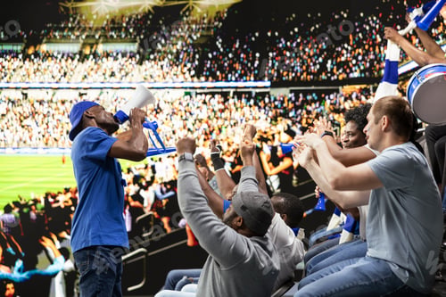 Preview: Excited football fan leader using bullhorn to unite blue supporter group
