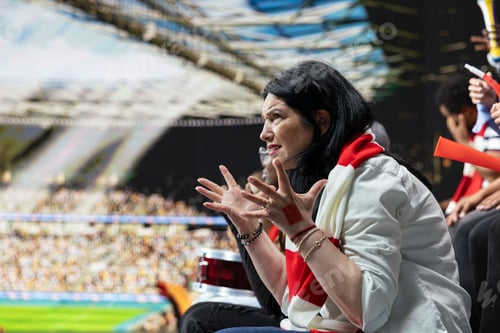 Preview: Frustrated mature woman football fan gesturing with open hands in disbelief