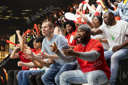 Preview: Diverse football fans following live score for betting odds on phone