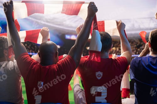 Preview: Close up of football supporters in red team kit waving scarf during match