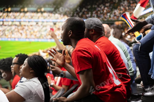 Preview: Focused football supporters watching dramatic final minutes of live soccer match