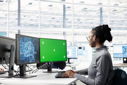 Preview: Green screen PC and AI in microchip factory RD office used by female technician