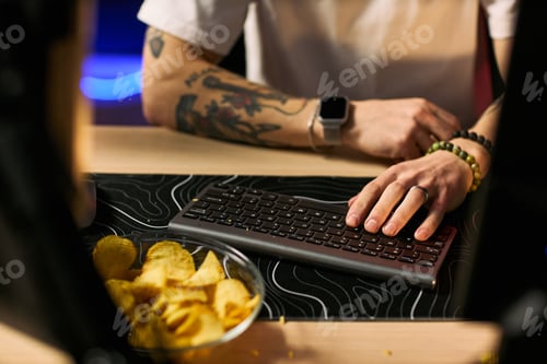 Preview: Adult Blogger Typing on Keyboard during Live Streaming Session