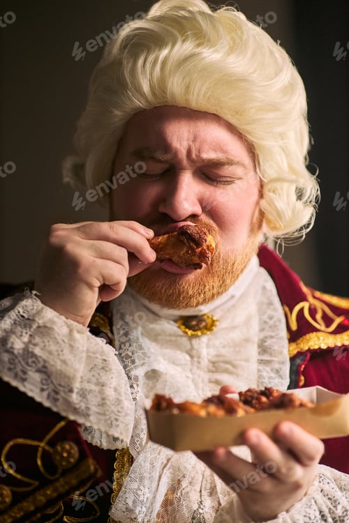 Preview: Man in Historical Costume Eating Fried Chicken with Enjoyment