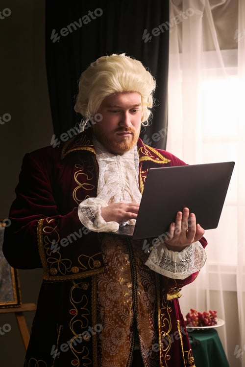 Preview: Man in Historical Costume Using Laptop for Remote Work