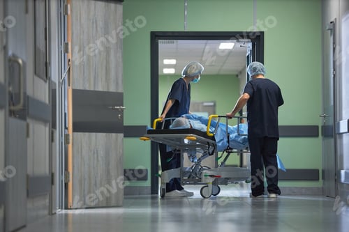 Preview: Medical Team Transporting Patient on Gurney through Hospital Corridor