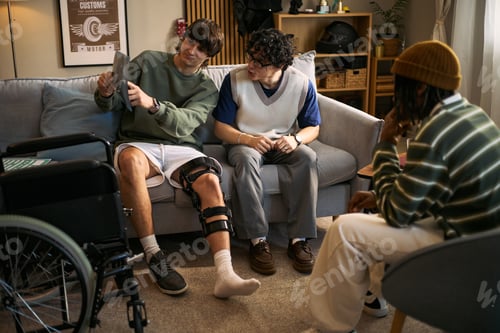 Preview: Teenage Boy with Disability Showing X Ray during Recovery Meeting