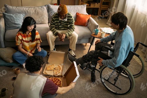Preview: Diverse Friends with Disability Sharing Pizza during Home Gathering