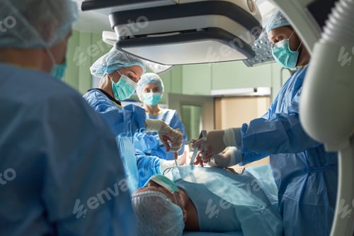 Preview: Medical Team Operating on Patient during Image Guided Hospital Surgery