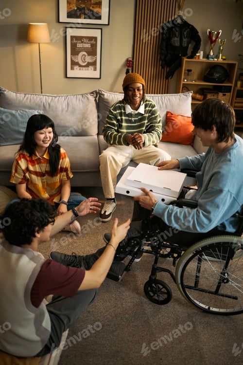 Preview: Diverse Teen Friends Sharing Pizza during Inclusive Home Gathering