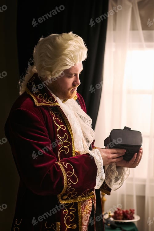 Preview: Man in Historical Costume Holding Virtual Reality Headset