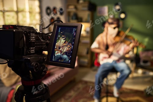 Preview: Young Man Playing Violin While Being Filmed for Music Content