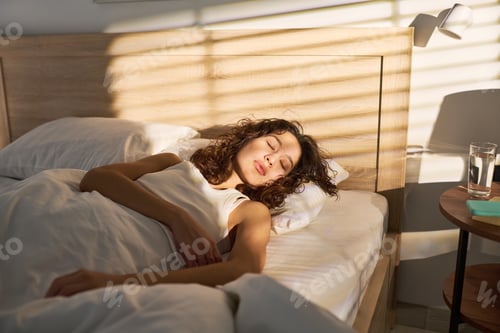 Preview: Woman Sleeping in Bed for Morning Routine and Wellness Concept