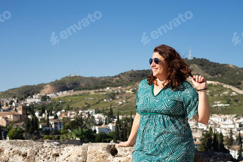 Preview: Tourist enjoying panoramic view of granada on sunny day with copy space