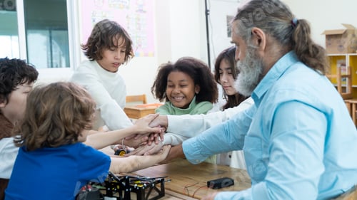 Preview: Teacher guiding multicultural children in collaborative learning