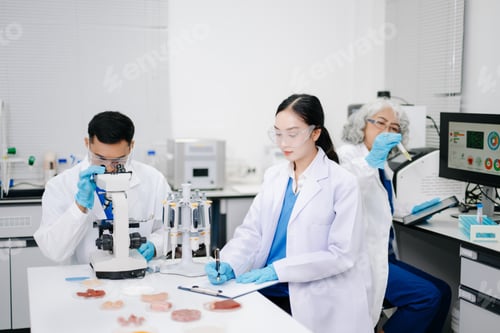 Preview: Team of Diverse Asian Scientists Conducting Research in Modern Laboratory