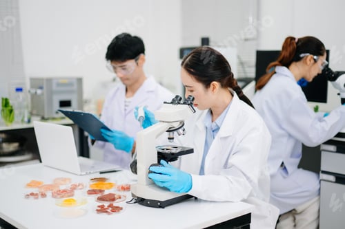 Preview: Professional scientists performing laboratory research with microscopes, biotechnology testing, medi