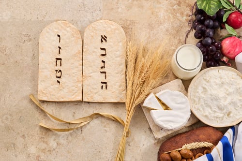 Preview: Shavuot holiday symbols and traditional foods representing dairy and wheat
