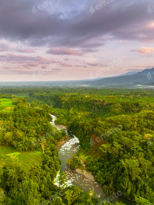 Preview: Beautiful morning view in Indonesia, panoramic landscape of rice fields with mountain ranges and cle