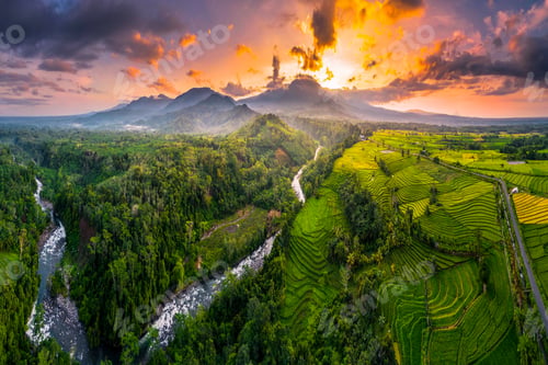 Preview: Beautiful morning view in Indonesia, panoramic landscape of rice fields with mountain ranges and cle
