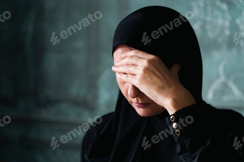 Preview: Muslim Woman Wearing Hijab Covering Her Face With Hand