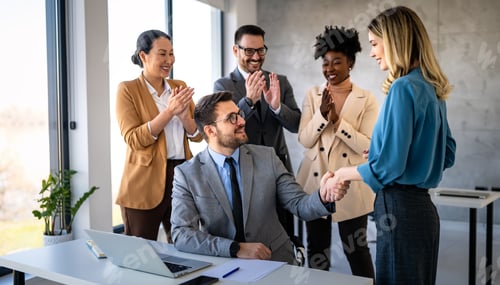 Preview: Multicultural professional businesspeople working together on research plan in boardroom.