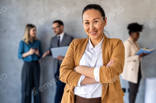 Preview: Multicultural professional businesspeople working together on research plan in boardroom.