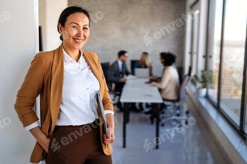 Preview: Professional in office environment, highlighting teamwork, collaboration, leadership, and innovation