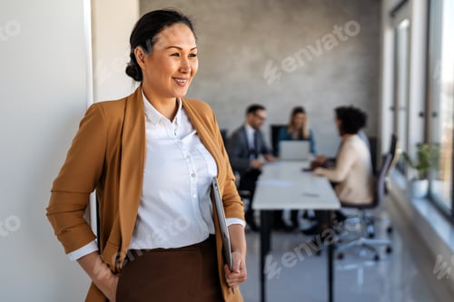 Preview: Successful executive standing proudly in office, representing business growth, partnership