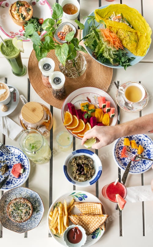 Preview: Mixed Western Healthy Food Meal on Restaurant Table Outdoors in Singapore Restaurant