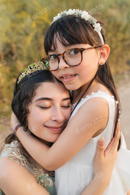 Preview: Emotional sisterhood portrait during coming of age family celebration vertical