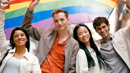 Preview: Diverse group friends celebrating pride month with rainbow flag
