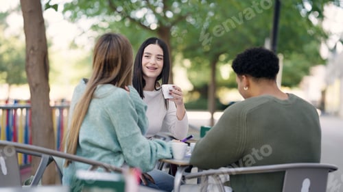 Preview: University students enjoying coffee and conversation outdoors on campus