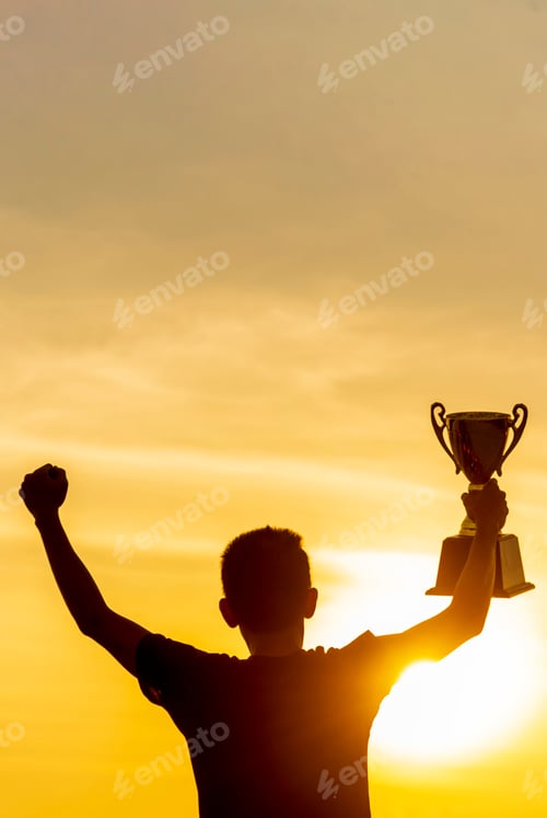 Preview: Vertical Winner win hands holding golden champion trophy cup prize. Silhouette best award victory ha