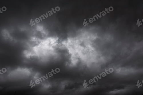 Preview: Dramatic dark storm rain clouds black sky background. Dark thunderstorm clouds rainny atmosphere. Me