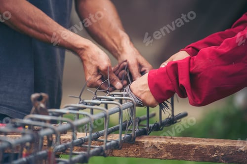 Preview: Construction Worker hands using pincer pliers iron wire. Outdoor Worker using wire bending pliers, c