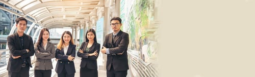 Preview: Portrait Group of businesspeople arms crossed smiling look at camera in modern city background