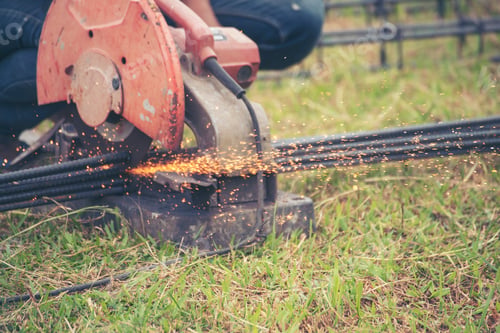 Preview: Construction Worker hands using Welding machinery iron metal sparking. Men hands wear protective glo
