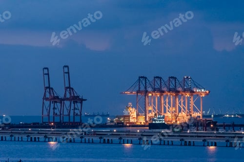 Preview: Logistic shipping quay boat in twilight sky night Engineering crane depot at logistic export termina