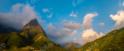 Preview: Banner Beautiful landscape mountain green field grass meadow white cloud blue sky on sunny day. pano