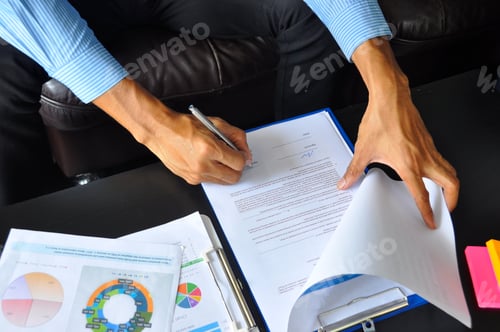 Preview: Business excel report Graphs chart on office table with stationery set business stuff. Financial Pla