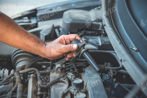 Preview: Close up Car Mechanic man hands repairing car auto repair shop. Man hands fixing machinery vehicle m