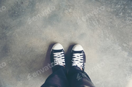 Preview: Life is journey, Black sneaker on the grasses. Travel Concept.
