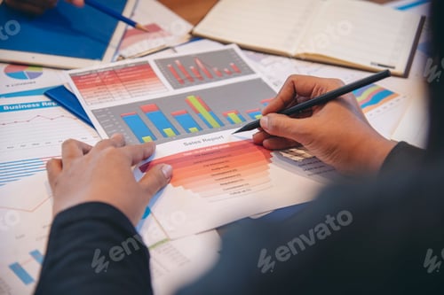 Preview: Two businesspeople meeting work at office desk. Teamwork partners team with Business strategy chart