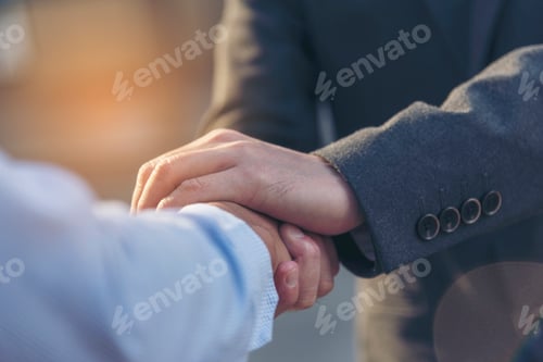 Preview: Concept partnership. Partners who is businessman and customer are touching hands promise to be hones