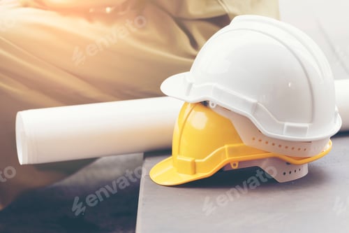Preview: Safety helmet white yellow. Protection head safety equipment in construction site. engineering conc