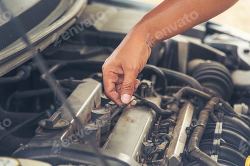 Preview: Close up Car Mechanic man hands repairing car auto repair shop. Man hands fixing machinery vehicle m