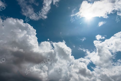 Preview: Blue sky fluffy white clouds on summer season bright clear skyline with beautiful cloudscape. Panora