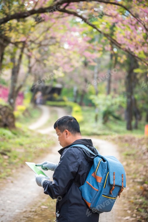 Preview: Vertical image Asian man use professional digital camera take a photo. Smiling male photographer loo